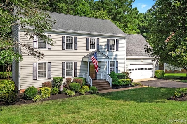 7906 Belmont Stakes Dr, Midlothian, VA 23112 - colonial inspired home featuring asphalt driveway, roof with shingles, an attached garage, and a front yard