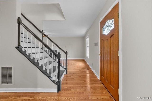 7906 Belmont Stakes Dr, Midlothian, VA 23112 - foyer entrance featuring stairway and light wood finished floors