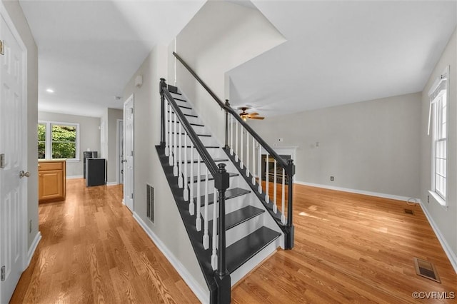 7906 Belmont Stakes Dr, Midlothian, VA 23112 - stairway featuring wood finished floors, ceiling fan, and recessed lighting