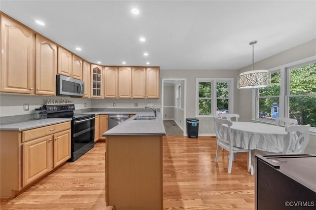 7906 Belmont Stakes Dr, Midlothian, VA 23112 - kitchen with appliances with stainless steel finishes, light brown cabinetry, light wood-type flooring, healthy amount of natural light, and recessed lighting