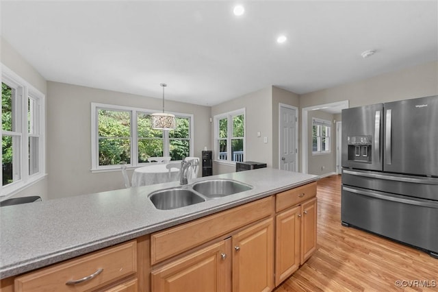7906 Belmont Stakes Dr, Midlothian, VA 23112 - kitchen with stainless steel fridge with ice dispenser, light wood-style flooring, light countertops, decorative light fixtures, and recessed lighting