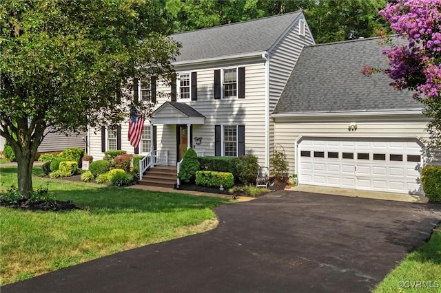 7906 Belmont Stakes Dr, Midlothian, VA 23112 - colonial house with roof with shingles, driveway, a garage, and a front yard