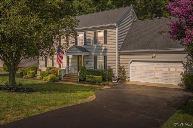 7906 Belmont Stakes Dr, Midlothian, VA 23112 - colonial inspired home with driveway, a shingled roof, a garage, and a front yard