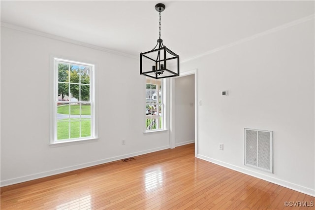 11918 Hazelnut Branch Ter, Midlothian, VA 23112 - empty room with a chandelier, light wood-style floors, plenty of natural light, and crown molding