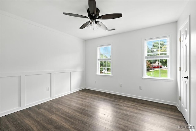 11918 Hazelnut Branch Ter, Midlothian, VA 23112 - empty room featuring plenty of natural light, dark wood-type flooring, and a ceiling fan