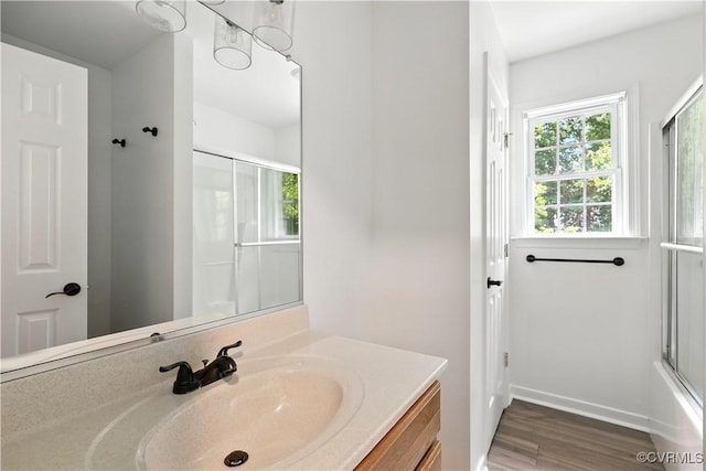 11918 Hazelnut Branch Ter, Midlothian, VA 23112 - full bathroom featuring vanity, wood finished floors, and combined bath / shower with glass door