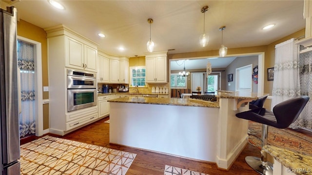 2024 Rockstone Pl, Henrico, VA 23238 - kitchen with appliances with stainless steel finishes, dark wood finished floors, stone counters, pendant lighting, and recessed lighting