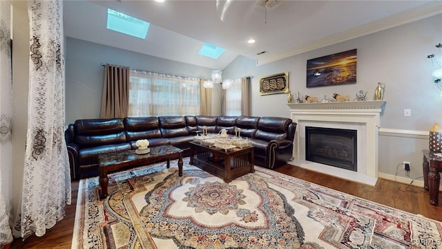 2024 Rockstone Pl, Henrico, VA 23238 - living area featuring a skylight, wood finished floors, a glass covered fireplace, vaulted ceiling, and recessed lighting