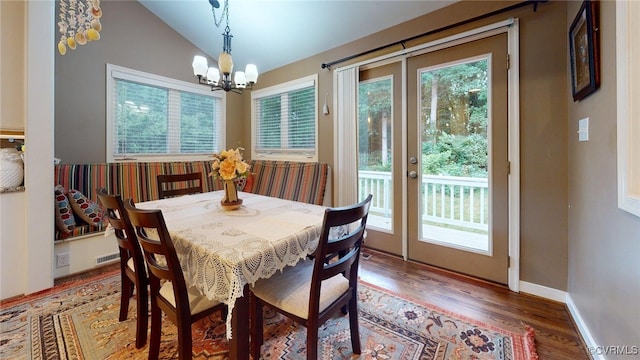 2024 Rockstone Pl, Henrico, VA 23238 - dining space with healthy amount of natural light, wood finished floors, lofted ceiling, and a chandelier