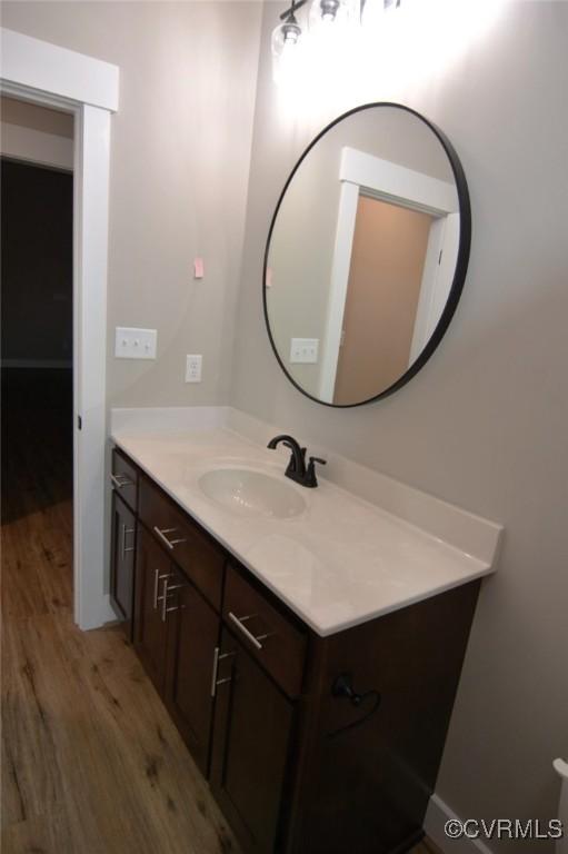 5102 Front Dr, North Dinwiddie, VA 23803 - bathroom with wood finished floors and vanity