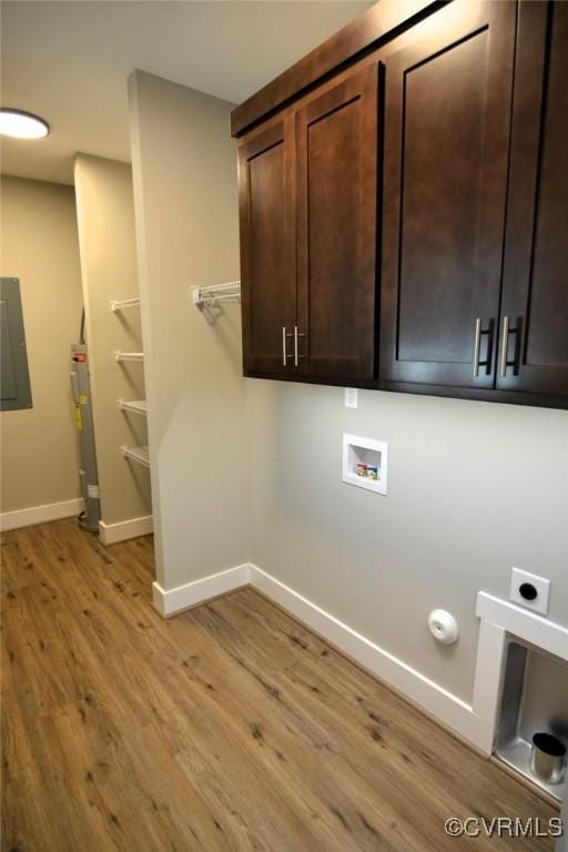 5102 Front Dr, North Dinwiddie, VA 23803 - laundry area featuring light wood-type flooring, hookup for a washing machine, cabinet space, electric water heater, and hookup for an electric dryer