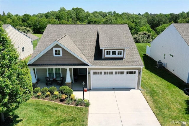 7413 Settlers Ridge Ct, Henrico, VA 23231 - view of front of house with concrete driveway, covered porch, a garage, a front yard, and a shingled roof