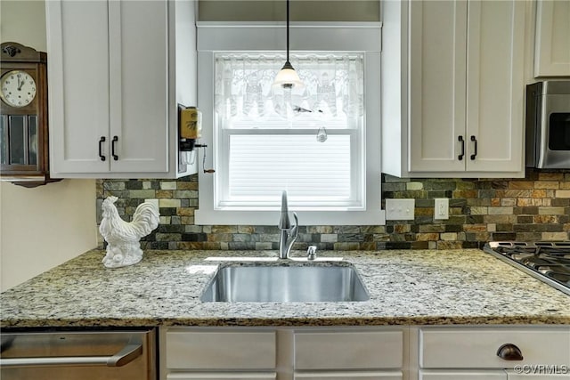 7413 Settlers Ridge Ct, Henrico, VA 23231 - kitchen with stainless steel appliances, white cabinetry, tasteful backsplash, and plenty of natural light