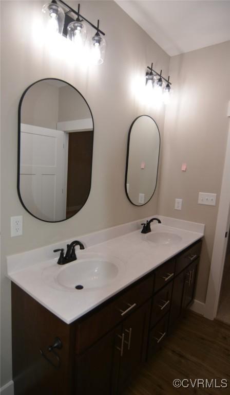 5104 Front Dr, North Dinwiddie, VA 23803 - bathroom with double vanity and wood finished floors