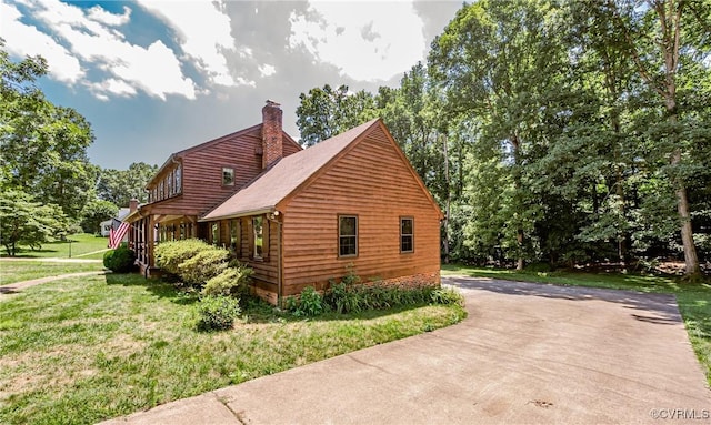 4320 Dunraven Rd, Chesterfield, VA 23236 - view of side of property featuring a chimney, a yard, and driveway
