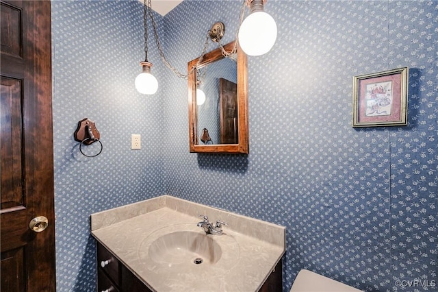4320 Dunraven Rd, Chesterfield, VA 23236 - bathroom with vanity and wallpapered walls