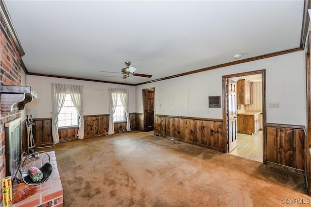 4320 Dunraven Rd, Chesterfield, VA 23236 - unfurnished living room with wainscoting, ornamental molding, ceiling fan, carpet floors, and a brick fireplace