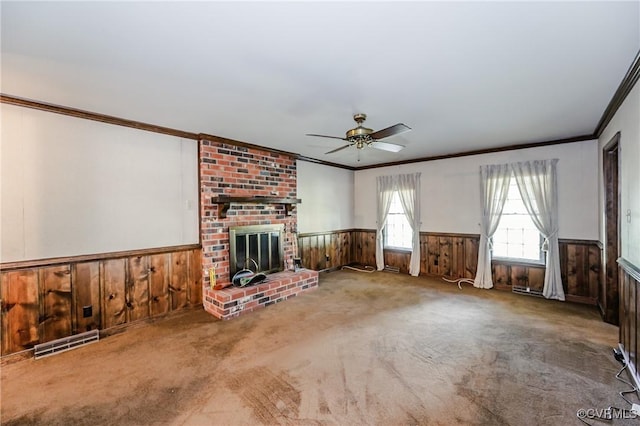 4320 Dunraven Rd, Chesterfield, VA 23236 - unfurnished living room with crown molding, wainscoting, wooden walls, a ceiling fan, and carpet