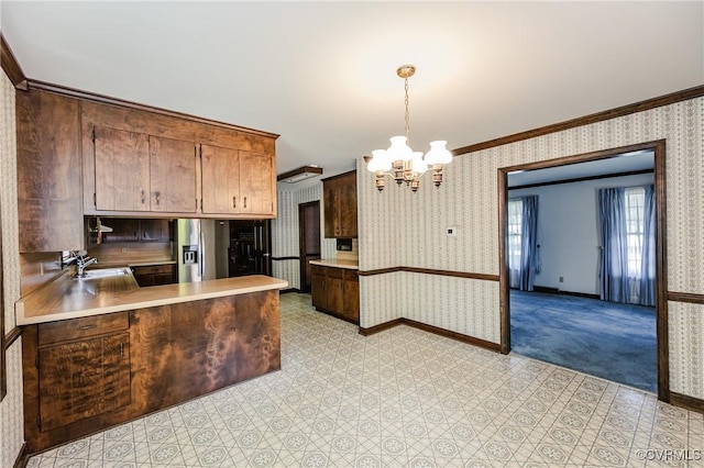 4320 Dunraven Rd, Chesterfield, VA 23236 - kitchen with wallpapered walls, stainless steel refrigerator with ice dispenser, a chandelier, crown molding, and light countertops