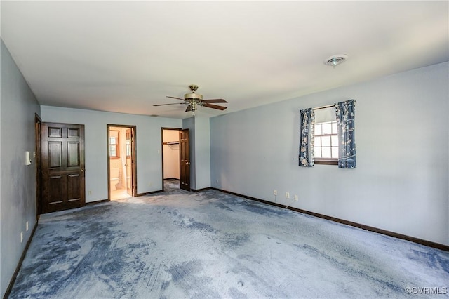 4320 Dunraven Rd, Chesterfield, VA 23236 - unfurnished bedroom featuring a walk in closet, carpet, a ceiling fan, and connected bathroom