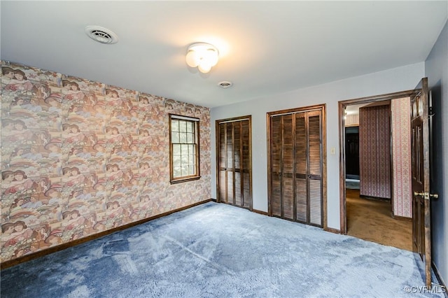 4320 Dunraven Rd, Chesterfield, VA 23236 - unfurnished bedroom with multiple closets and carpet flooring
