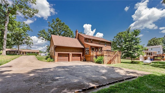 4320 Dunraven Rd, Chesterfield, VA 23236 - view of front of home featuring a wooden deck, stairway, concrete driveway, a garage, and a front yard
