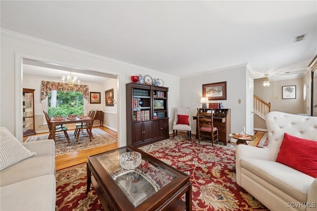 3000 Cove Ridge Rd, Midlothian, VA 23112 - living room featuring a chandelier, crown molding, wood finished floors, and stairs