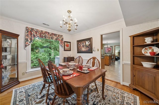3000 Cove Ridge Rd, Midlothian, VA 23112 - dining area with a chandelier, ornamental molding, and light wood finished floors