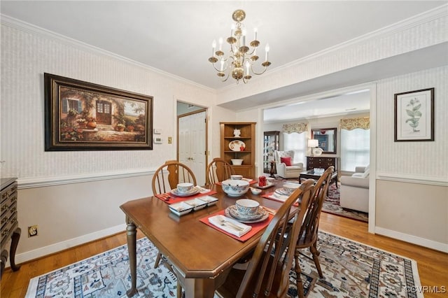 3000 Cove Ridge Rd, Midlothian, VA 23112 - dining space with a chandelier, wallpapered walls, crown molding, and wood finished floors