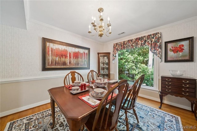 3000 Cove Ridge Rd, Midlothian, VA 23112 - dining room with a chandelier, ornamental molding, wood finished floors, and wallpapered walls