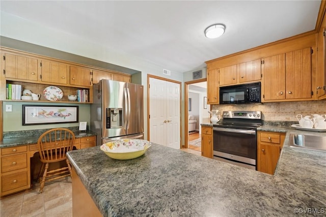 3000 Cove Ridge Rd, Midlothian, VA 23112 - kitchen featuring appliances with stainless steel finishes, built in study area, dark countertops, and backsplash