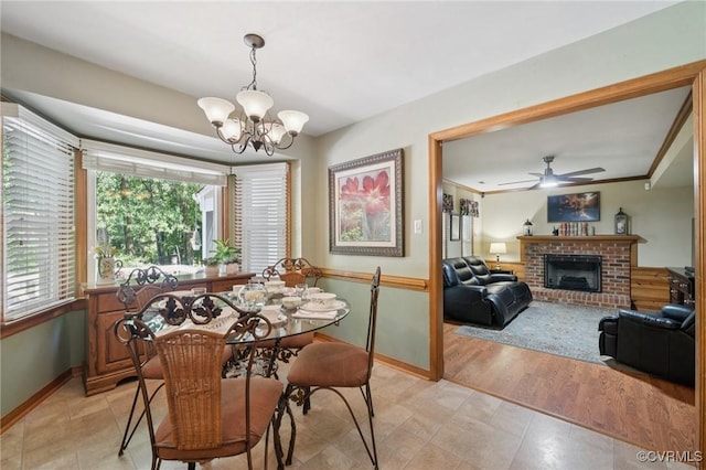 3000 Cove Ridge Rd, Midlothian, VA 23112 - dining room featuring a chandelier, ceiling fan, a fireplace, and light tile patterned flooring