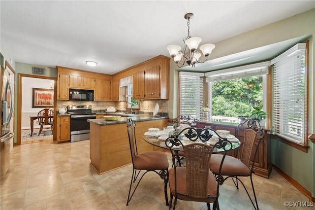 3000 Cove Ridge Rd, Midlothian, VA 23112 - dining room with a chandelier and baseboards