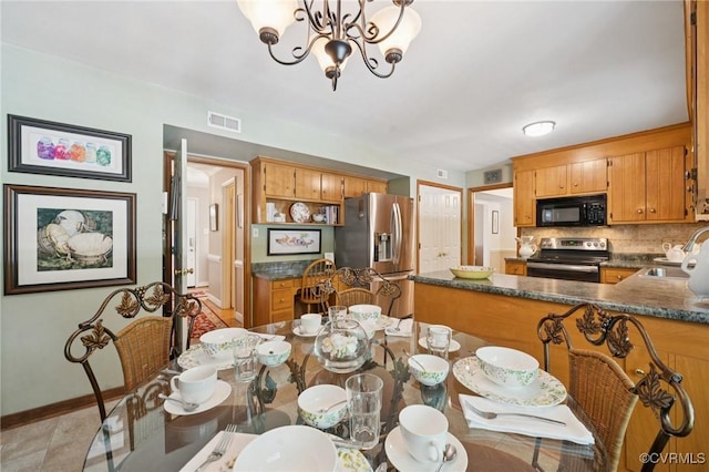 3000 Cove Ridge Rd, Midlothian, VA 23112 - dining area with a chandelier and baseboards