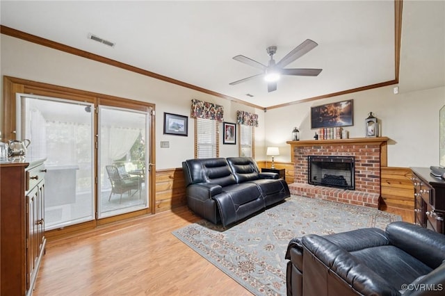 3000 Cove Ridge Rd, Midlothian, VA 23112 - living room featuring wood finished floors, crown molding, ceiling fan, a fireplace, and wainscoting