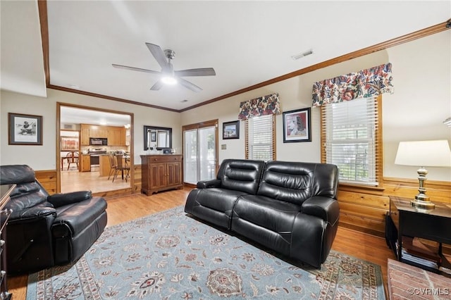 3000 Cove Ridge Rd, Midlothian, VA 23112 - living area with light wood-style flooring, a ceiling fan, ornamental molding, and a wainscoted wall