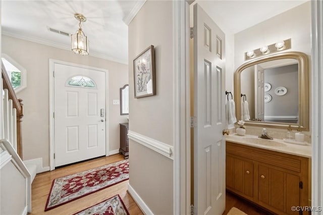 3000 Cove Ridge Rd, Midlothian, VA 23112 - entryway featuring light wood finished floors and crown molding