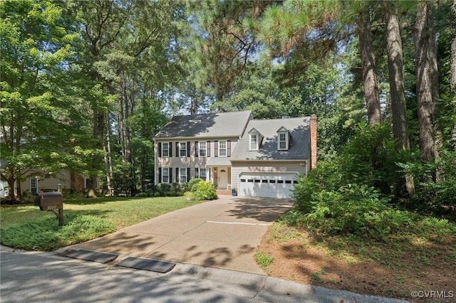 3000 Cove Ridge Rd, Midlothian, VA 23112 - colonial home featuring concrete driveway, a chimney, and a front lawn