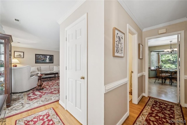 3000 Cove Ridge Rd, Midlothian, VA 23112 - corridor with light wood-style floors, ornamental molding, and a chandelier