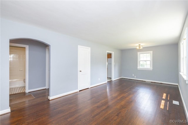 6500 W Grace St, Henrico, VA 23226 - unfurnished room with arched walkways and dark wood-style flooring