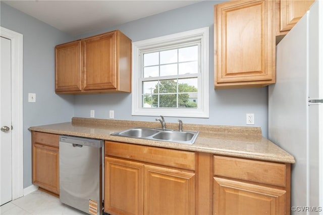 6500 W Grace St, Henrico, VA 23226 - kitchen with stainless steel dishwasher, freestanding refrigerator, light countertops, and light tile patterned floors