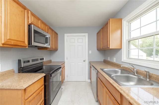 6500 W Grace St, Henrico, VA 23226 - kitchen featuring appliances with stainless steel finishes, light marble finish flooring, and light countertops