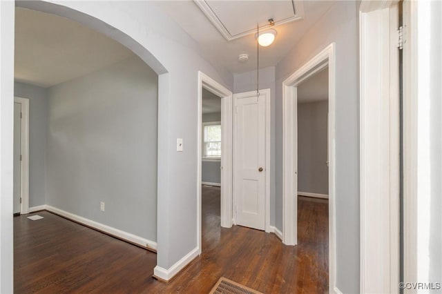 6500 W Grace St, Henrico, VA 23226 - hall with attic access, dark wood-style flooring, and arched walkways