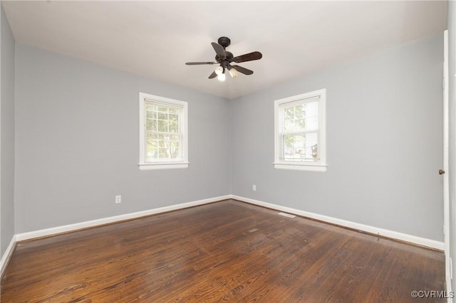 6500 W Grace St, Henrico, VA 23226 - empty room featuring plenty of natural light, dark wood finished floors, and a ceiling fan