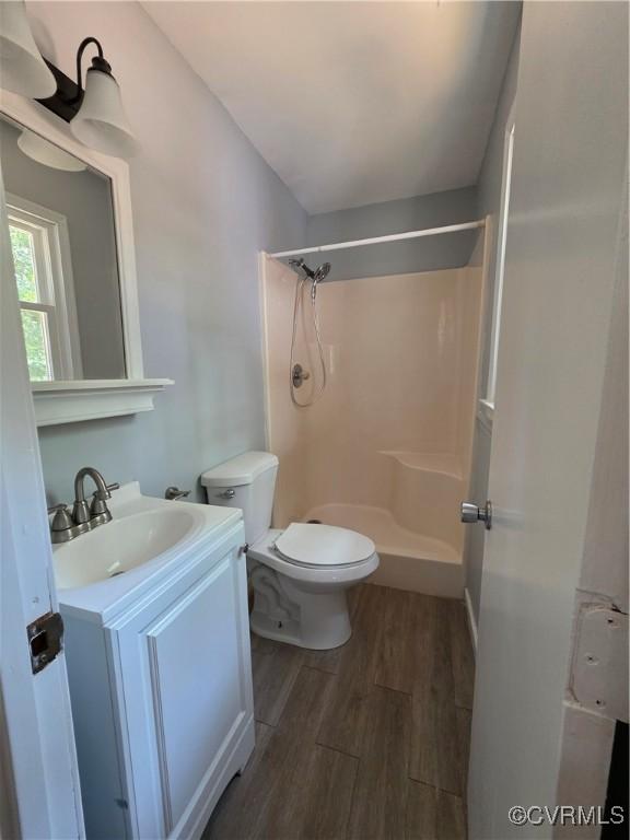 11220 Sunfield Dr, Midlothian, VA 23112 - full bath with wood finished floors, a shower, and vanity