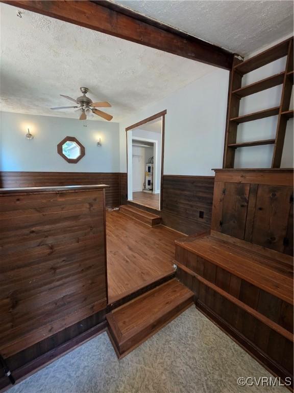 11220 Sunfield Dr, Midlothian, VA 23112 - bedroom with a textured ceiling, wainscoting, wooden walls, and wood finished floors