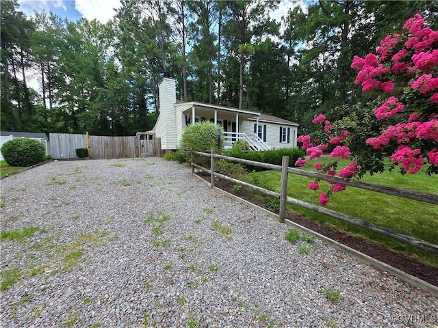 11220 Sunfield Dr, Midlothian, VA 23112 - view of front of property with driveway, a chimney, a porch, and a gate