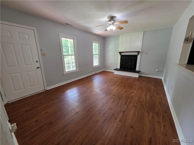 11220 Sunfield Dr, Midlothian, VA 23112 - unfurnished living room featuring ceiling fan, dark wood-type flooring, and a fireplace