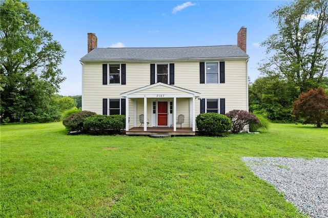 3167 Trenholm Rd, Powhatan, VA 23139 - colonial home featuring a chimney, a front lawn, and a porch