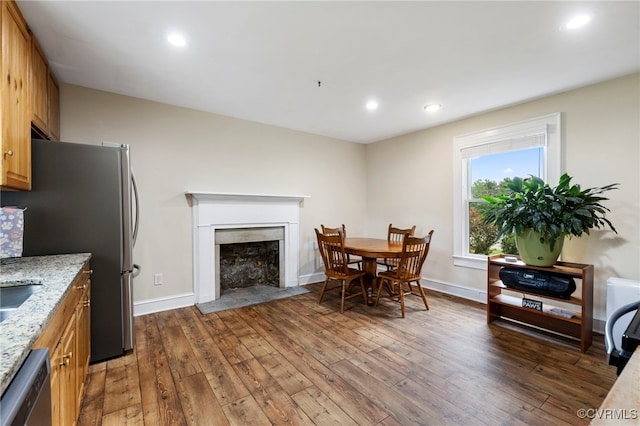 3167 Trenholm Rd, Powhatan, VA 23139 - dining area featuring wood-type flooring, a fireplace with flush hearth, and recessed lighting